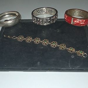 Bracelets ,three with clasps one stretch fit.